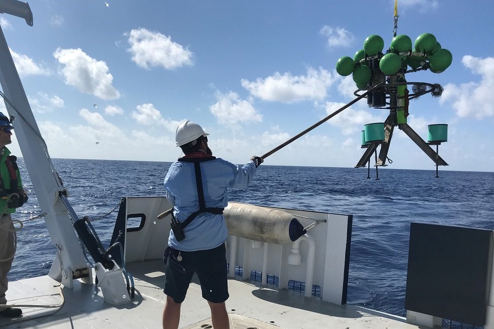 Researchers deploy a mooring, which will help them measure exchanges of waters. [Photo courtesy FAU]